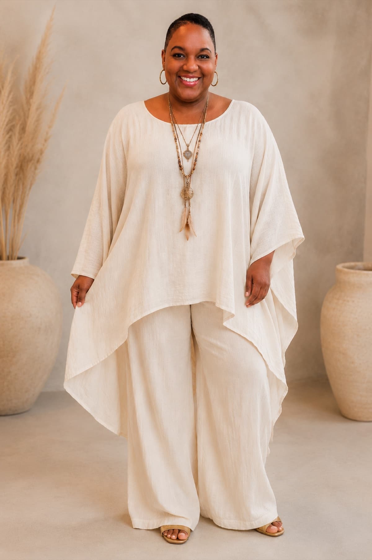 Chief Dr. Ayele Kumari standing in flowing cream linen